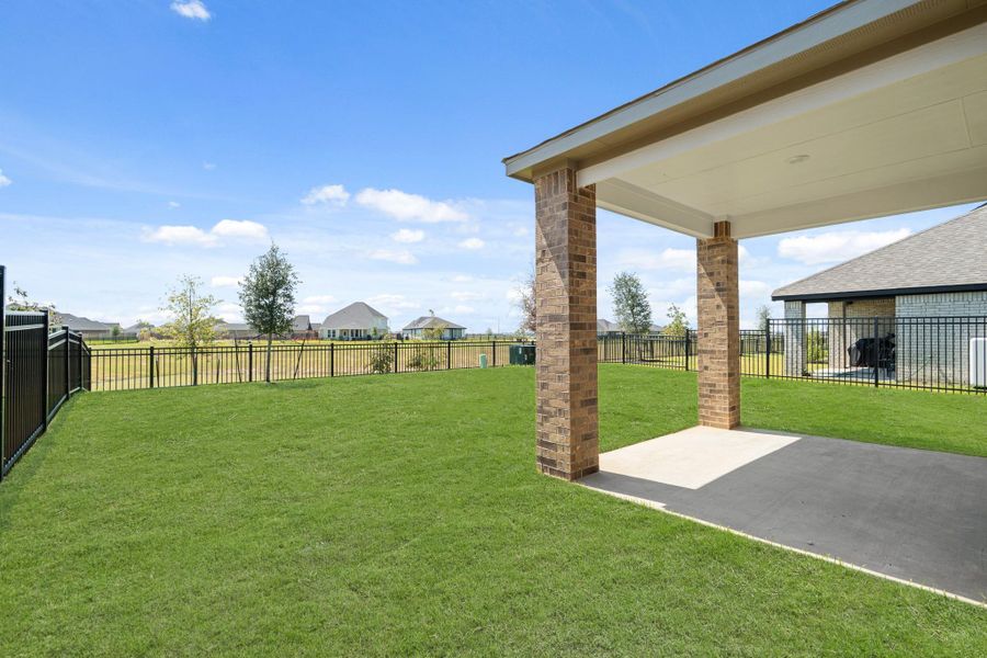 Front exterior of a new home in Sunterra, Katy, TX, highlighting curb appeal (Image 14). Front exterior of a new home in Sunterra, Katy, TX, highlighting curb appeal (Image 14).
