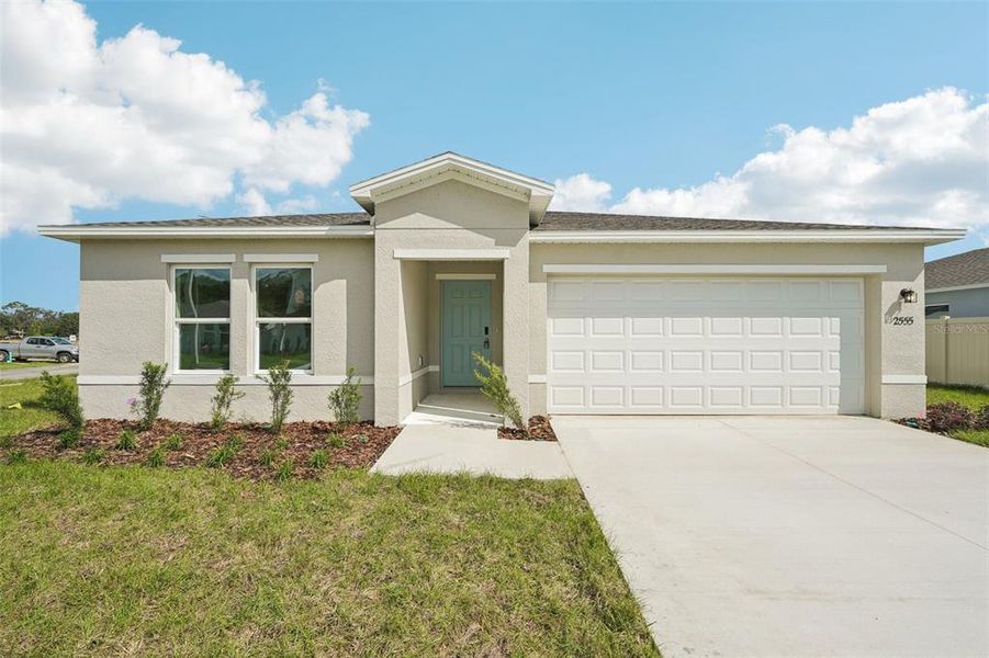 Front exterior of a new home in West Oak, Ocala, FL, highlighting curb appeal (Image 1). Front exterior of a new home in West Oak, Ocala, FL, highlighting curb appeal (Image 1).