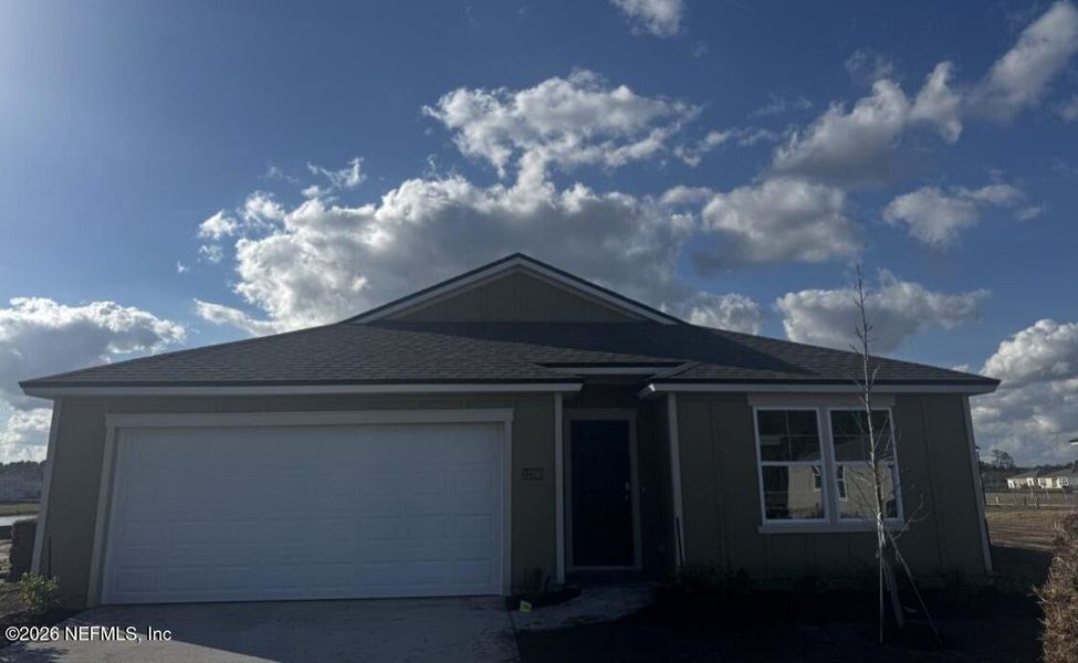 Front exterior of a new home in The Arbors, Jacksonville, FL, highlighting curb appeal (Image 2).
