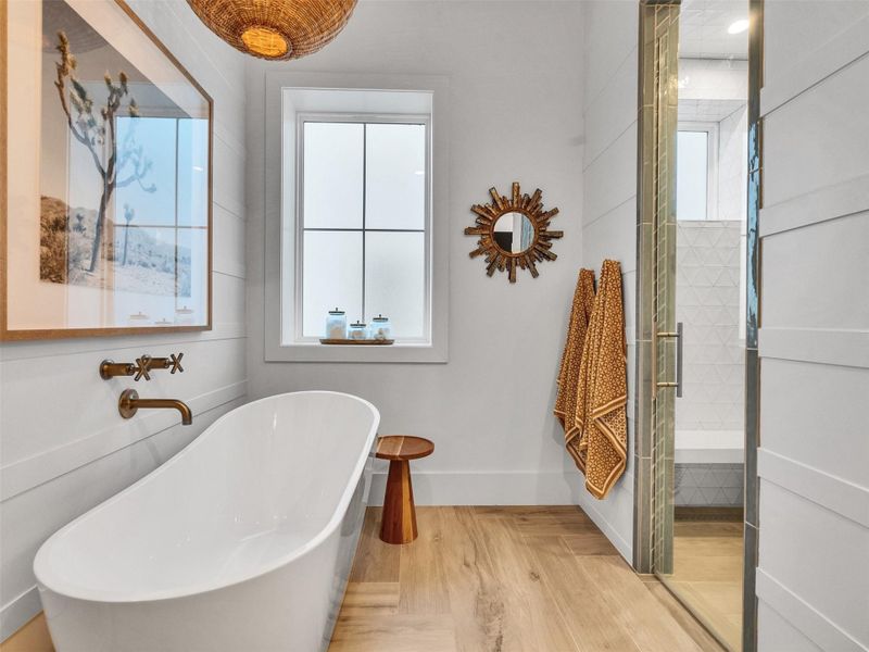 Imagine ending your evening with a warm soak in the freestanding tub as natural light filters through the window. Across the room, the sleek glass-enclosed shower offers the perfect refresh after a day of coastal adventures. Every detail was crafted to make life here feel both luxurious and deeply personal. Imagine ending your evening with a warm soak in the freestanding tub as natural light filters through the window. Across the room, the sleek glass-enclosed shower offers the perfect refresh after a day of coastal adventures. Every detail was crafted to make life here feel both luxurious and deeply personal.