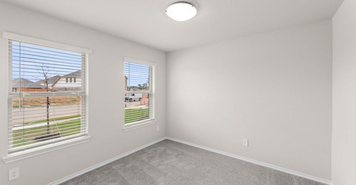 Representative exterior photo of a completed home built from the Austin by Impression Homes in Keeneland, Aubrey, TX (Image 19).