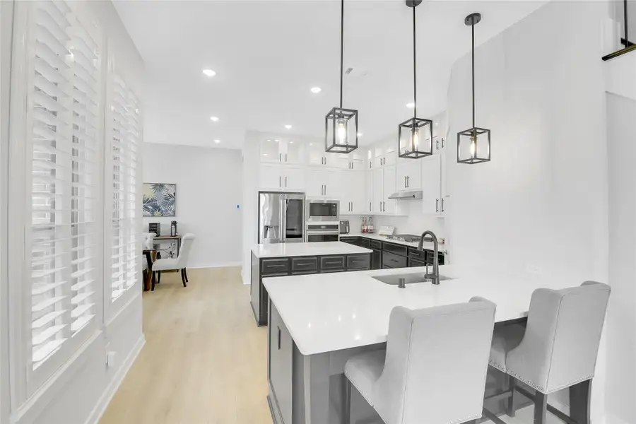 Kitchen Breakfast Bar with added Pendant lighting above.