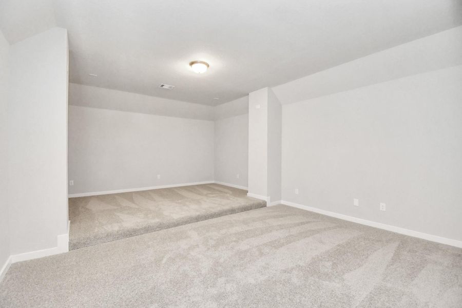 Ascend to relaxation in this fantastic game room! Ideal for both casual gatherings and adult gaming, it boasts plush carpet, lofty ceilings, custom paint, and ample windows for abundant natural light. Sample photo of completed home with similar floor plan. Actual colors and selections may vary. Ascend to relaxation in this fantastic game room! Ideal for both casual gatherings and adult gaming, it boasts plush carpet, lofty ceilings, custom paint, and ample windows for abundant natural light. Sample photo of completed home with similar floor plan. Actual colors and selections may vary.