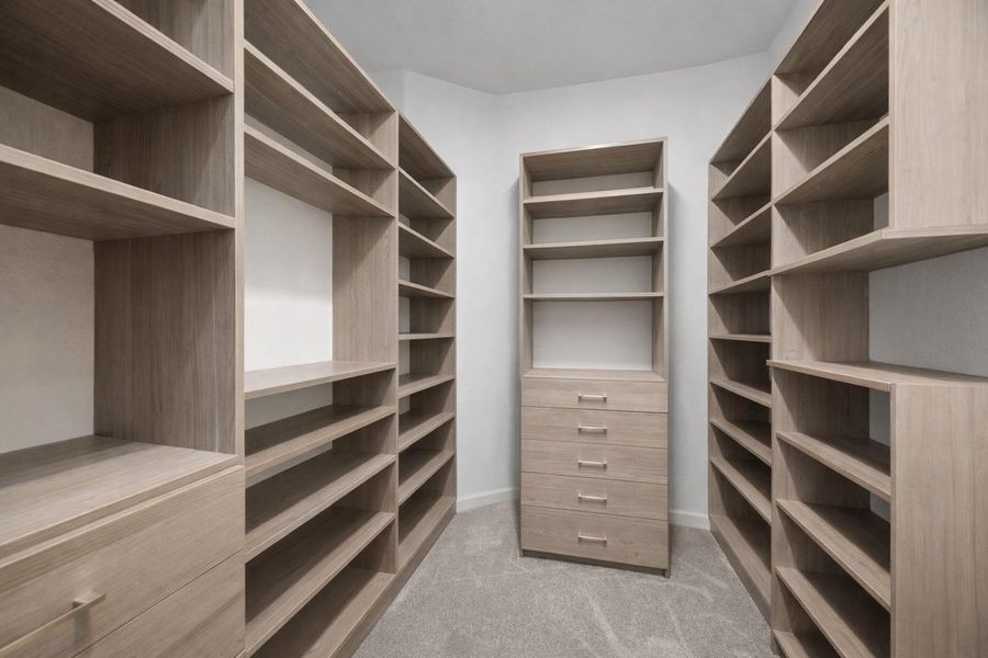 Custom closet system allows for ample storage with seasonal changes. (This is one view, other side reflects the same)