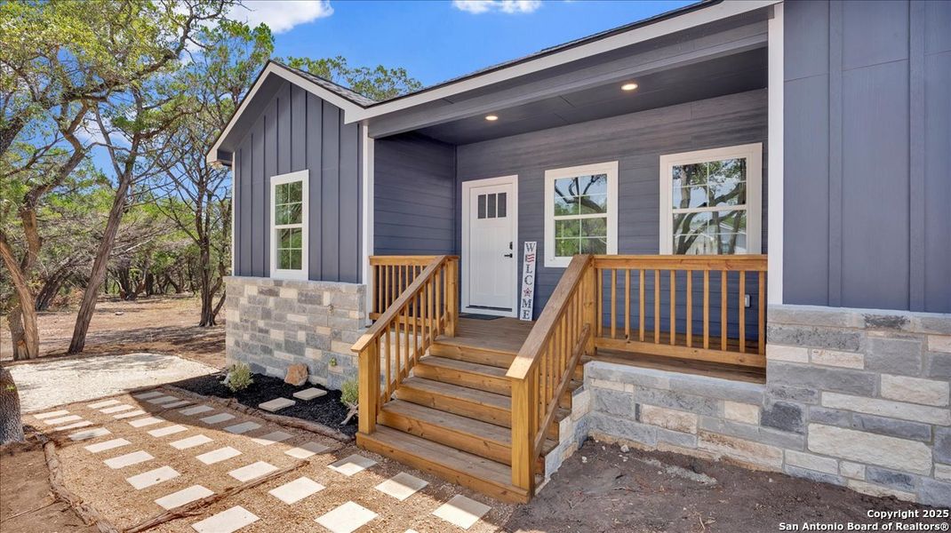 Front exterior of a new home in , Bandera, TX, highlighting curb appeal (Image 20). Front exterior of a new home in , Bandera, TX, highlighting curb appeal (Image 20).