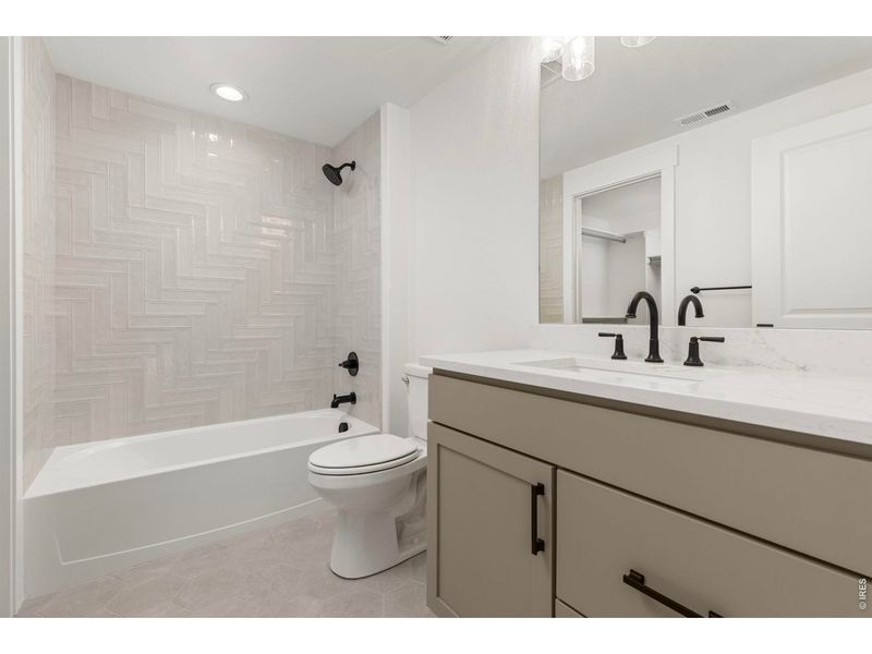 Furnished interior view inside a new home in RainDance, Windsor (Image 7).