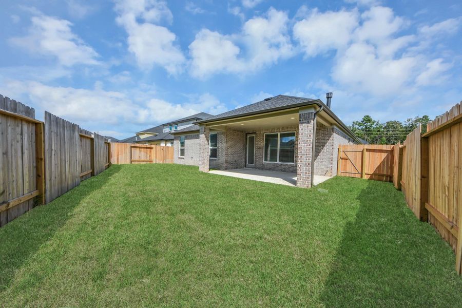 Experience outdoor living at its finest on this expansive covered patio, thoughtfully designed for BBQs and delightful outdoor dining.