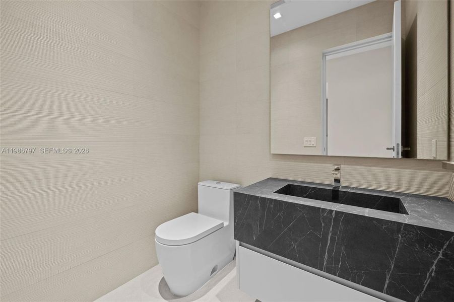 Powder Room - Located off Entry Foyer