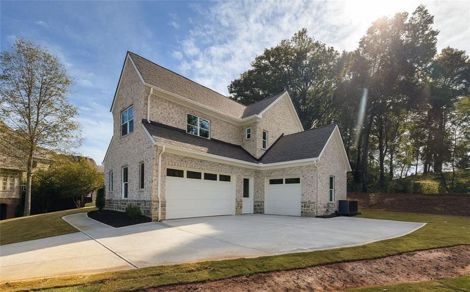 Front exterior of a new home in , Marietta, GA, highlighting curb appeal (Image 1).