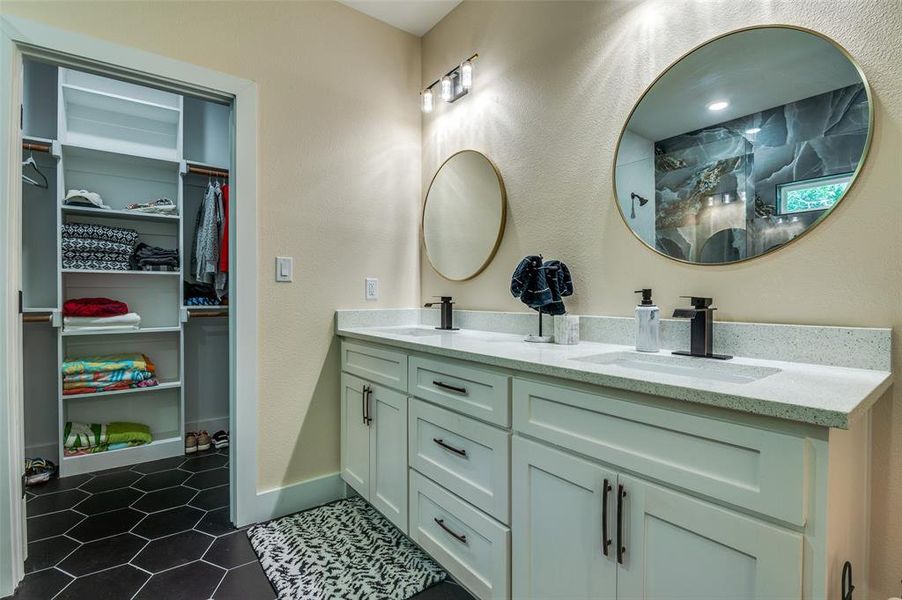 Primary bathroom features a double vanity, and a spacious closet Primary bathroom features a double vanity, and a spacious closet