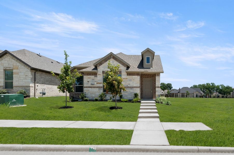 Front exterior of a new home in Redden Farms – Active Adult, Midlothian, TX, highlighting curb appeal (Image 1). Front exterior of a new home in Redden Farms – Active Adult, Midlothian, TX, highlighting curb appeal (Image 1).