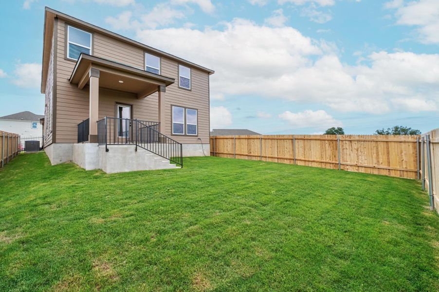Front exterior of a new home in Creekside at Estancia, Austin, TX, highlighting curb appeal (Image 15).