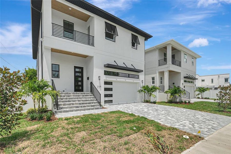 Front exterior of a new home in , Tampa, FL, highlighting curb appeal (Image 25).