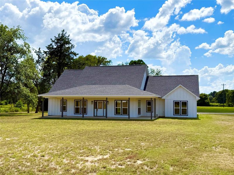 Front exterior of a new home in , Grapeland, TX, highlighting curb appeal (Image 1).