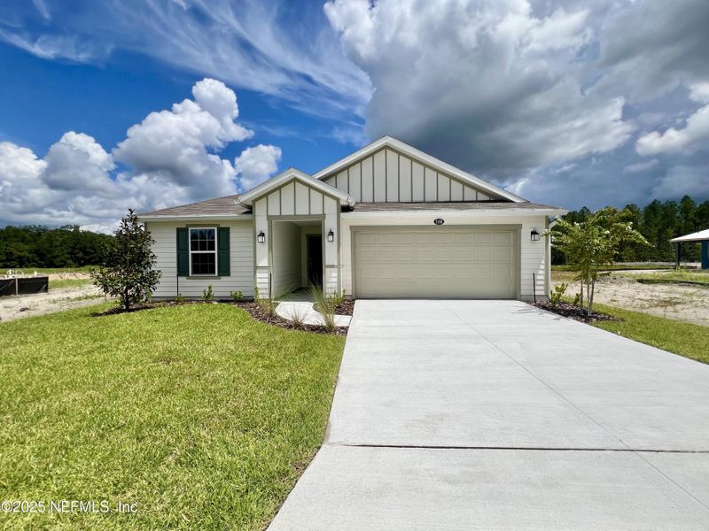 Front exterior of a new home in Bellbrooke, Jacksonville, FL, highlighting curb appeal (Image 1). Front exterior of a new home in Bellbrooke, Jacksonville, FL, highlighting curb appeal (Image 1).