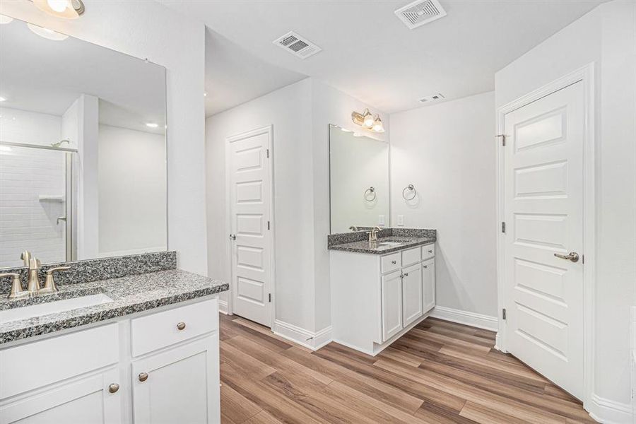 Primary Bathroom with Separate Vanities