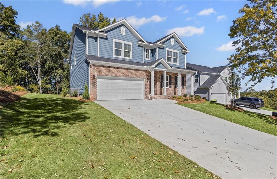 Front exterior of a new home in Watermist at Mirror Lake, Villa Rica, GA, highlighting curb appeal (Image 2).