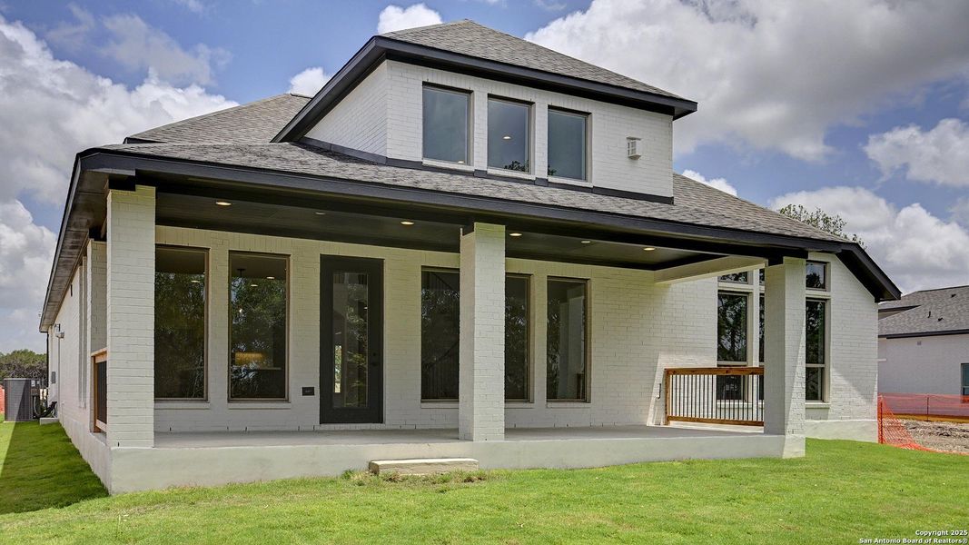 Front exterior of a new home in Esperanza 60', Boerne, TX, highlighting curb appeal (Image 2). Front exterior of a new home in Esperanza 60', Boerne, TX, highlighting curb appeal (Image 2).
