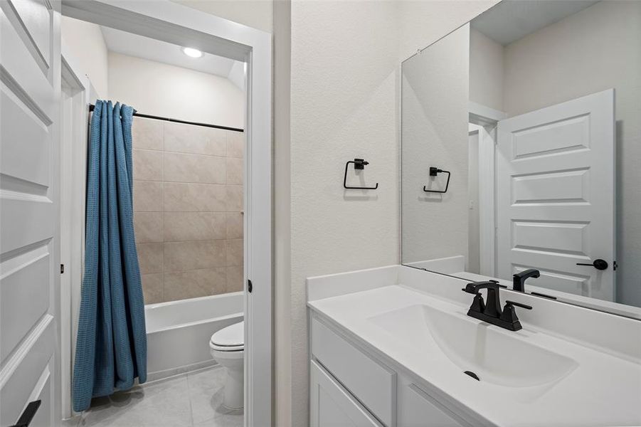 The second floor also offers two bedrooms attached to a full bathroom, also with a tub/shower combination.