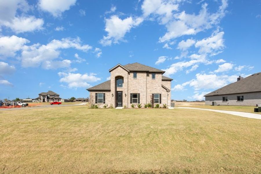 Representative exterior photo of a completed home built from the The Pine by Sumeer Homes in Stone Henge II, Sanger, TX (Image 16). Representative exterior photo of a completed home built from the The Pine by Sumeer Homes in Stone Henge II, Sanger, TX (Image 16).
