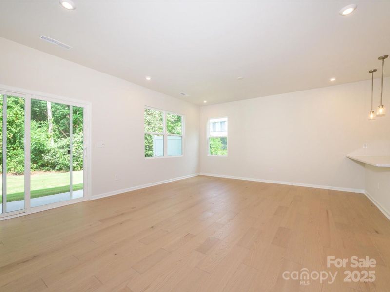 Connected living spaces and tree-lined views at every window. Connected living spaces and tree-lined views at every window.