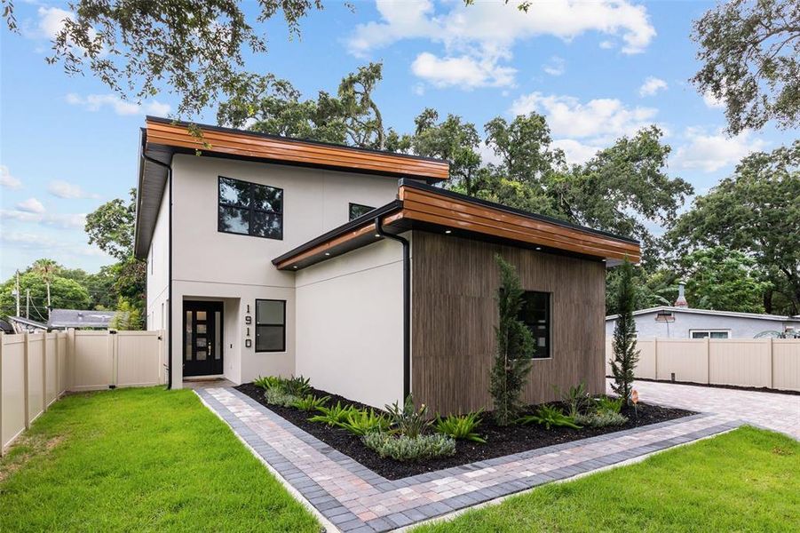 Front exterior of a new home in , Orlando, FL, highlighting curb appeal (Image 28).