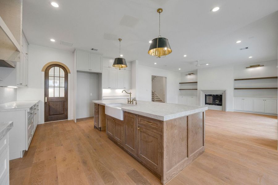 Through the arched doorway ahead is a scullery/prep kitchen that offers ample pantry space with added function. Through the arched doorway ahead is a scullery/prep kitchen that offers ample pantry space with added function.