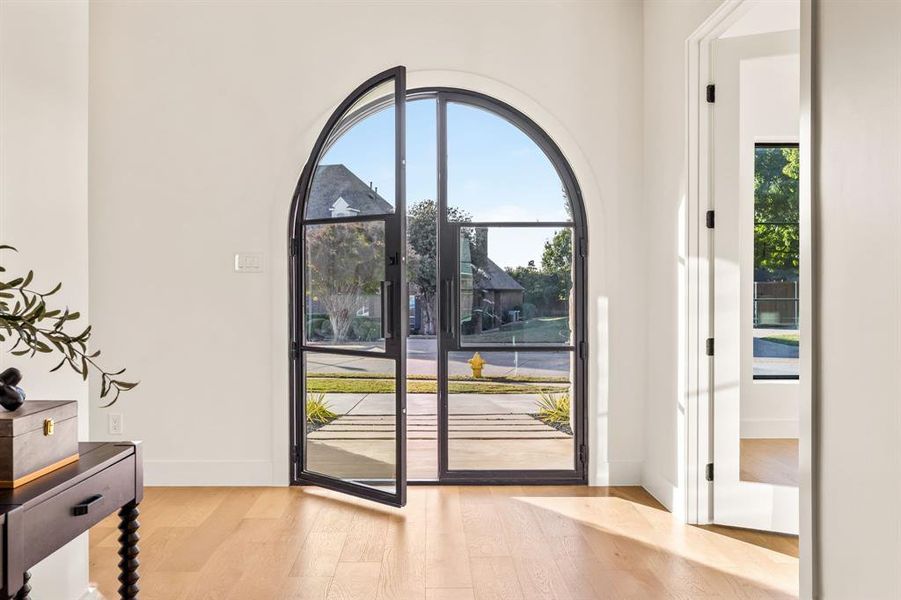 Entryway featuring wood finished floors and baseboards Entryway featuring wood finished floors and baseboards
