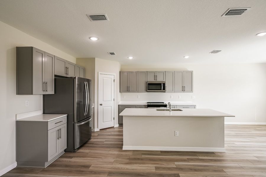 Furnished interior view inside a new home in Pasadena Ridge, Dade City (Image 6).