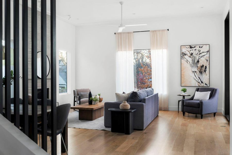Living room with light wood-style flooring