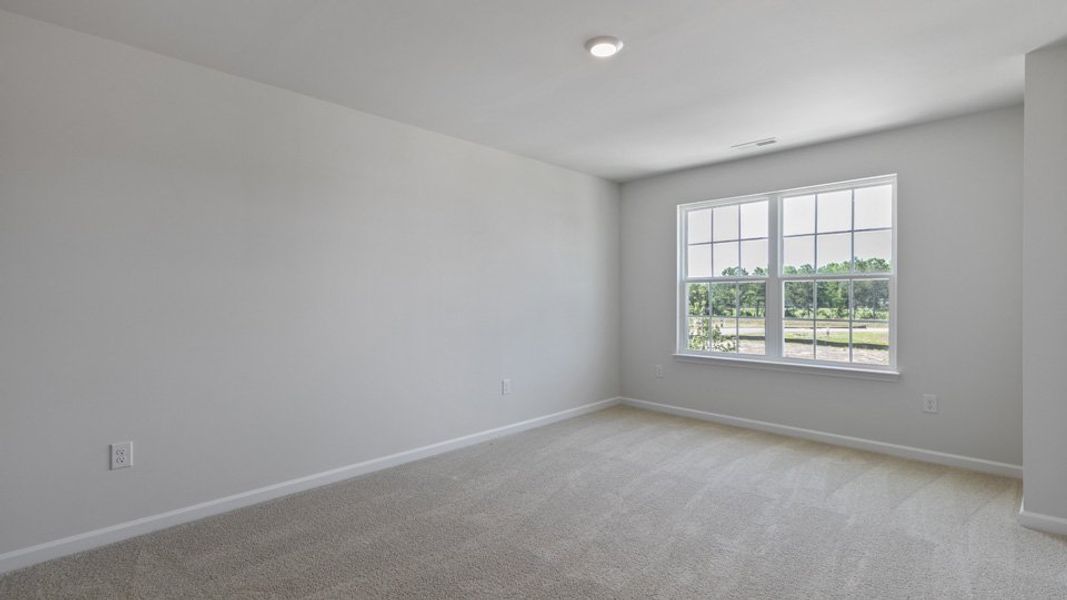 Spacious, unfurnished interior of a new home in The Townes at Bexford, Willow Spring (Image 10).