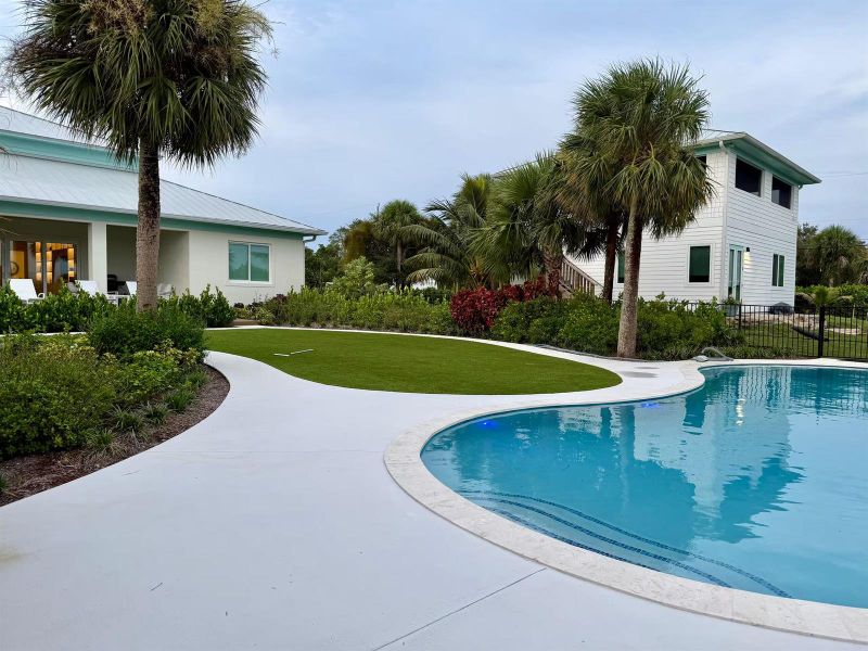both houses rear view with astroturf and both houses rear view with astroturf and