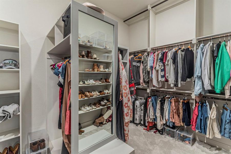 Walk in closet with light carpet Walk in closet with light carpet