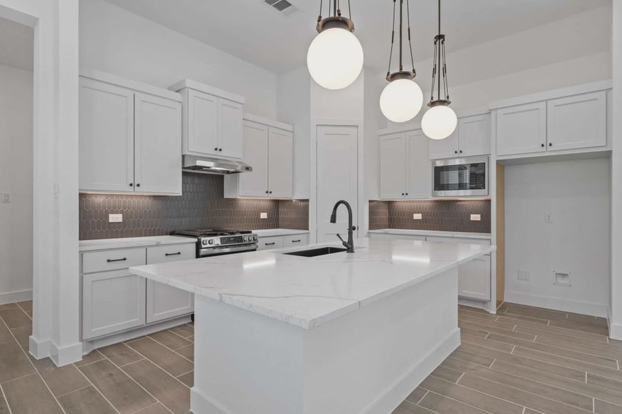 Representative furnished interior of a home built from the Augusta by Chesmar Homes in Riceland Alley Loads, Mont Belvieu (Image 7).