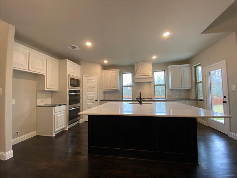 Clean & modern colors in kitchen with black cabinet island with white quartz coounters looks like a custom furniture piece! Clean & modern colors in kitchen with black cabinet island with white quartz coounters looks like a custom furniture piece!