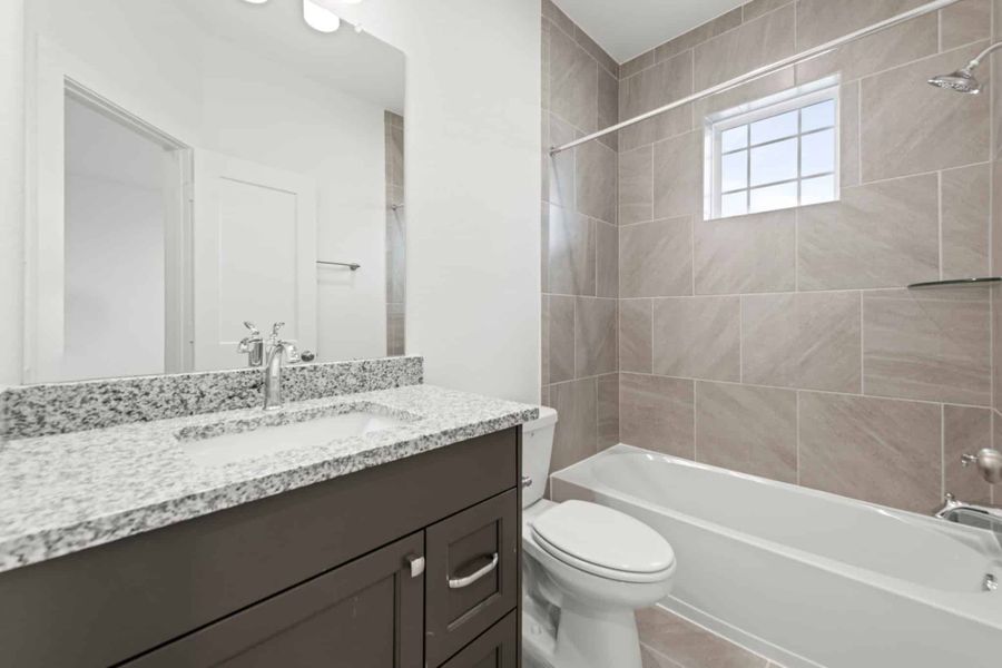 Representative furnished interior of a home built from the Rivers 60′ Lot by Chesmar Homes in Fulshear Lakes, Fulshear (Image 16).