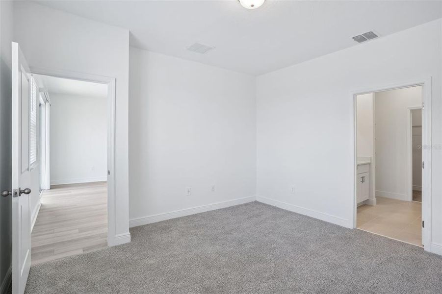 Spacious, unfurnished interior of a new home in Cyrene at Minneola - Villas, Montverde (Image 13). Spacious, unfurnished interior of a new home in Cyrene at Minneola - Villas, Montverde (Image 13).