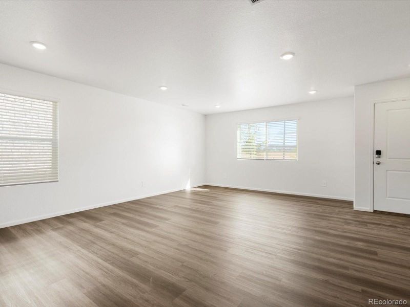 Main Level Living Room w/ LVP Flooring.