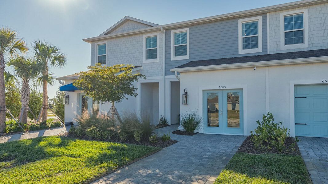 Exterior details and patio area of a home in Grand Park Real Estate and Homes for Sale in Sarasota, FL - Neal Communities, Sarasota (Image 3).
