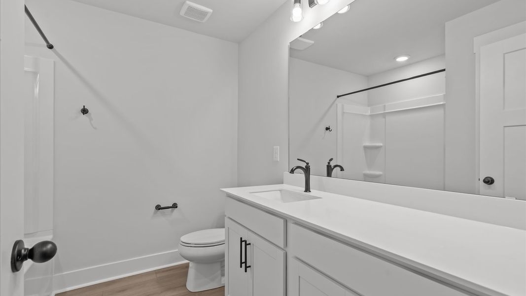 Elegant bath retreat with designer finishes and a clean, timeless aesthetic Elegant bath retreat with designer finishes and a clean, timeless aesthetic