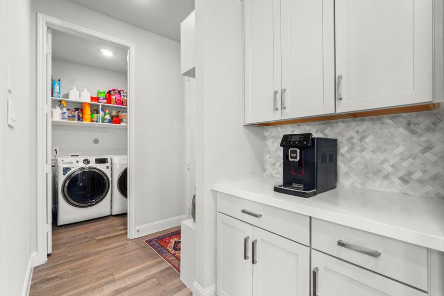 Coffee bar/nook in the Kitchen is so nice to have! So much space for storage in the Kitchen cabinets and the Laundry Room is just beyond the Kitchen.