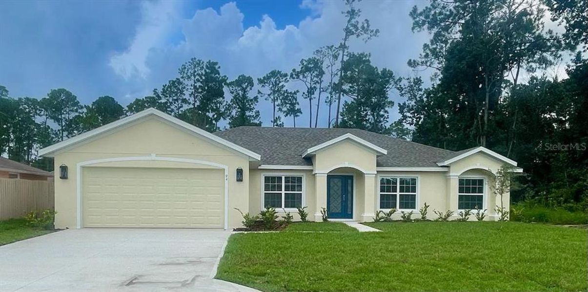 Front exterior of a new home in , Palm Coast, FL, highlighting curb appeal (Image 1).