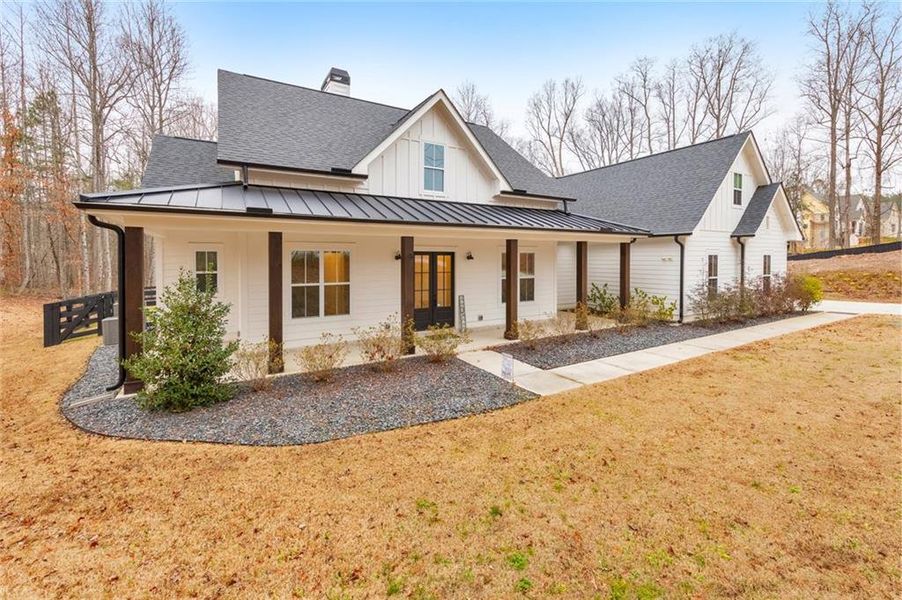 Front exterior of a new home in , Woodstock, GA, highlighting curb appeal (Image 25).