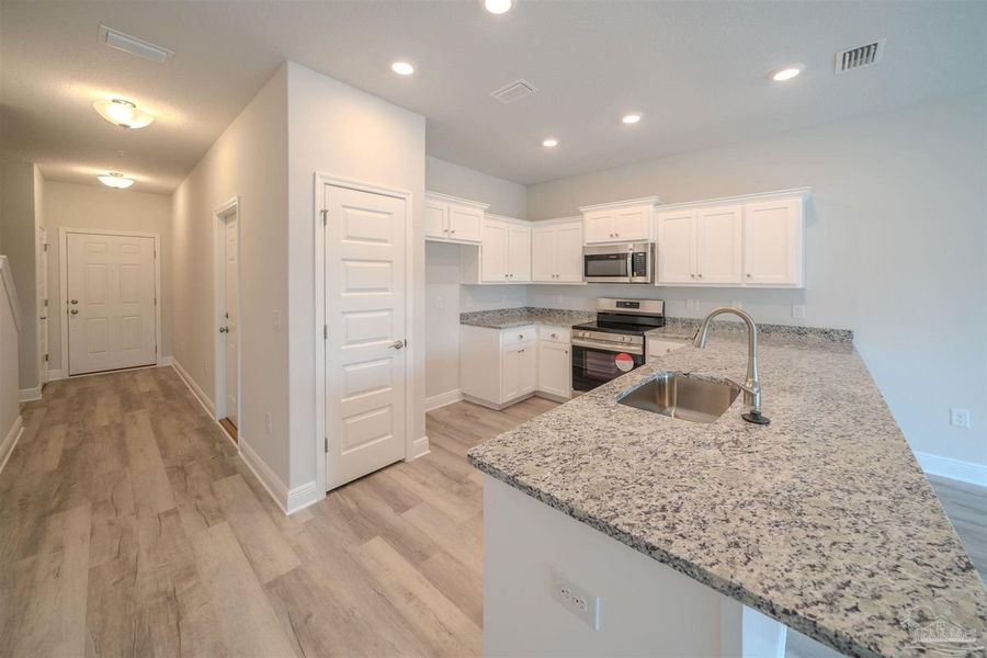 Representative furnished interior of a home built from the Plan 1542 Townhome by Adams Homes in Lexlee Estates, Pensacola (Image 3). Representative furnished interior of a home built from the Plan 1542 Townhome by Adams Homes in Lexlee Estates, Pensacola (Image 3).