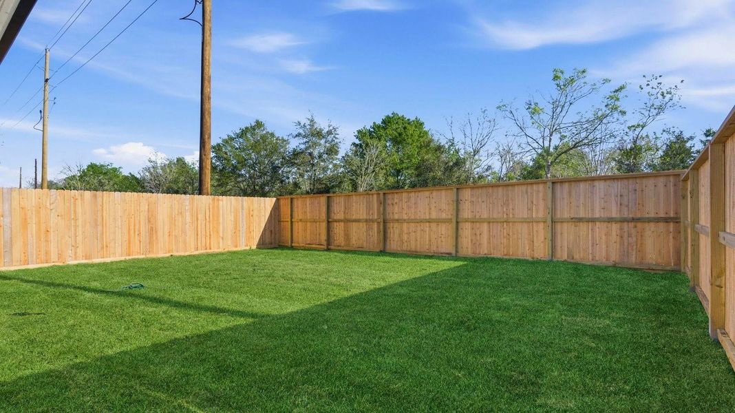 Outdoor covered patio with room for outdoor furniture to enjoy the backyard in those cooler months