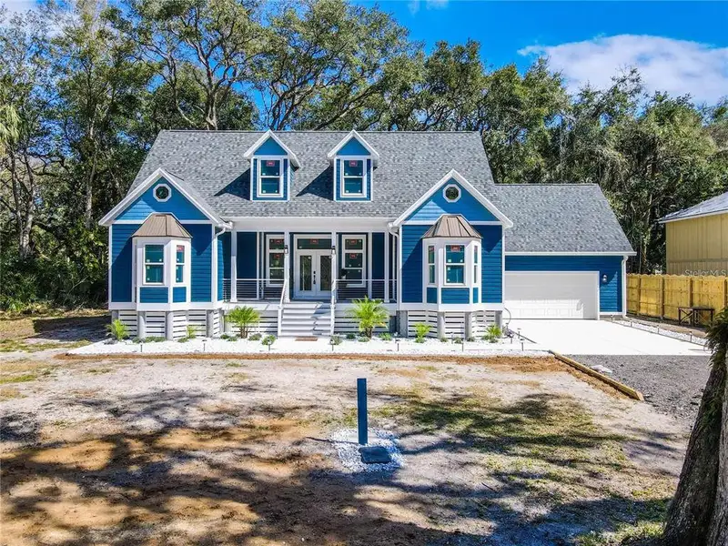 Front exterior of a new home in , Palm Coast, FL, highlighting curb appeal (Image 1). Front exterior of a new home in , Palm Coast, FL, highlighting curb appeal (Image 1).