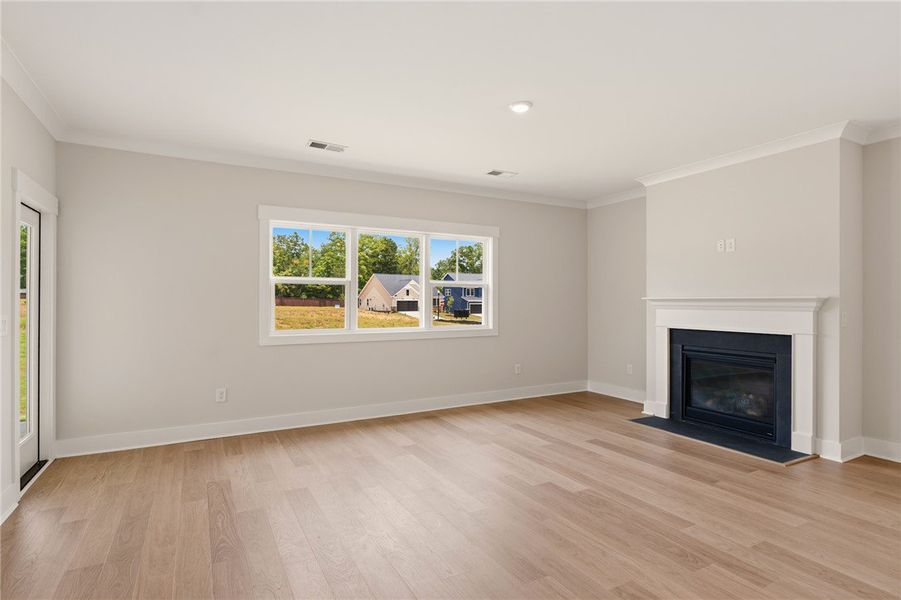 A refined fireplace and ample window light grace t