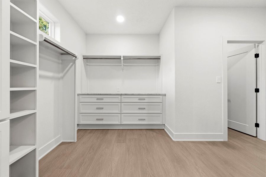 Primary walk-in closet Primary walk-in closet
