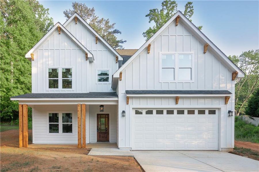 Front exterior of a new home in , Austell, GA, highlighting curb appeal (Image 1). Front exterior of a new home in , Austell, GA, highlighting curb appeal (Image 1).