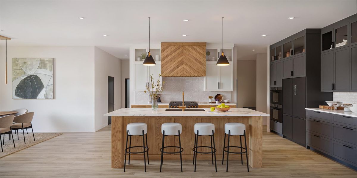 A grand central island anchors this spacious kitchen, boasting premium finishes and contemporary design. A grand central island anchors this spacious kitchen, boasting premium finishes and contemporary design.